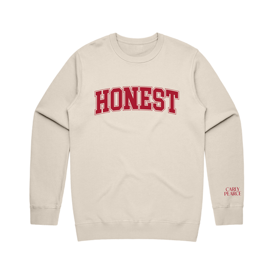 Honest screenprinted on the front of a sand sweatshirt with Carly Pearce logo on the sleeve
