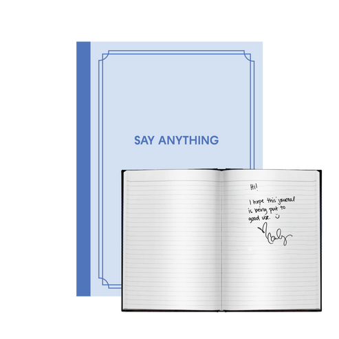 A blue journal with the title 'SAY ANYTHING' on the cover, shown open with lined pages and a signature on one page.